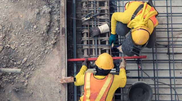 aerial view of a construction site and workers