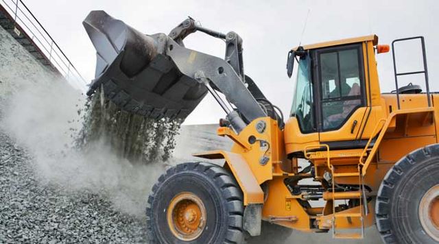 Heavy equipment moving gravel