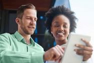 Employees reviewing information on tablet