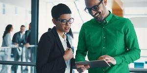 Accounts receivable employees in conference room chatting and smiling