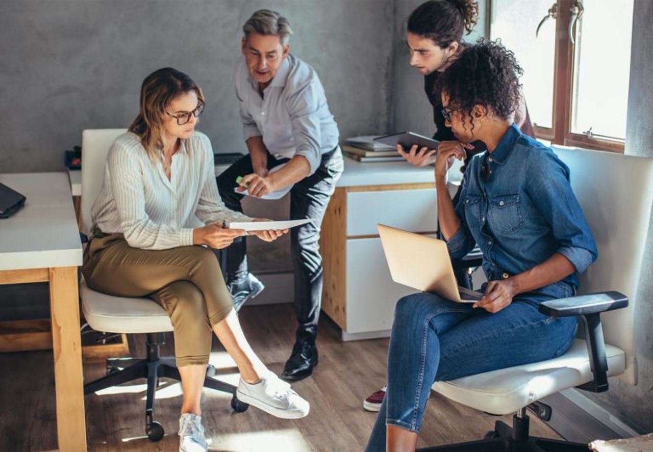 Small business team reviewing a document together