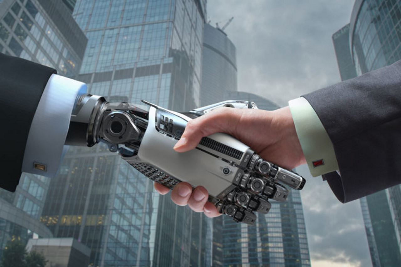 man's hand shaking robot's hand with city background