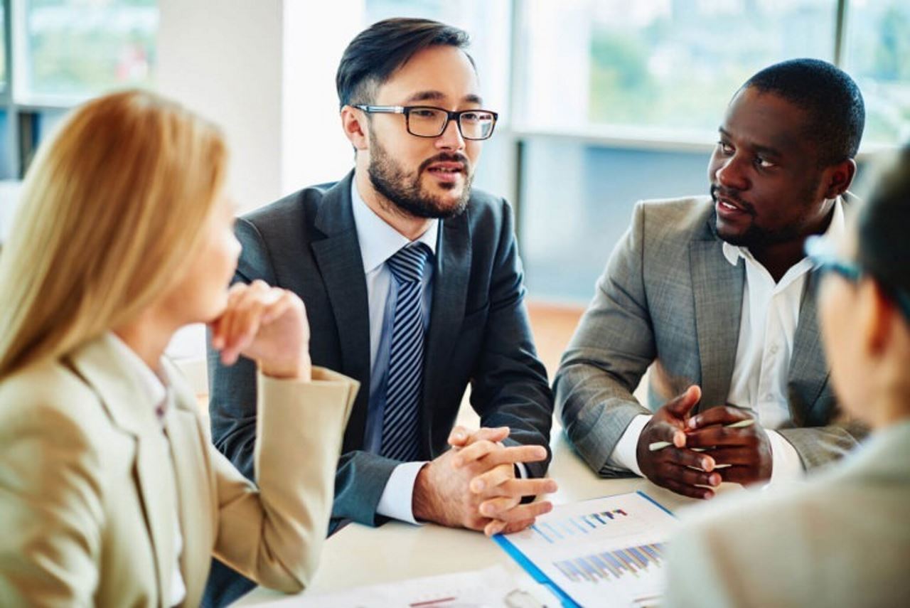 two men two women in billtrust office during meeting