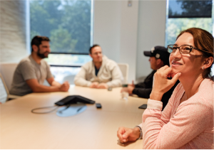 Customer Support Employees sitting in meeting