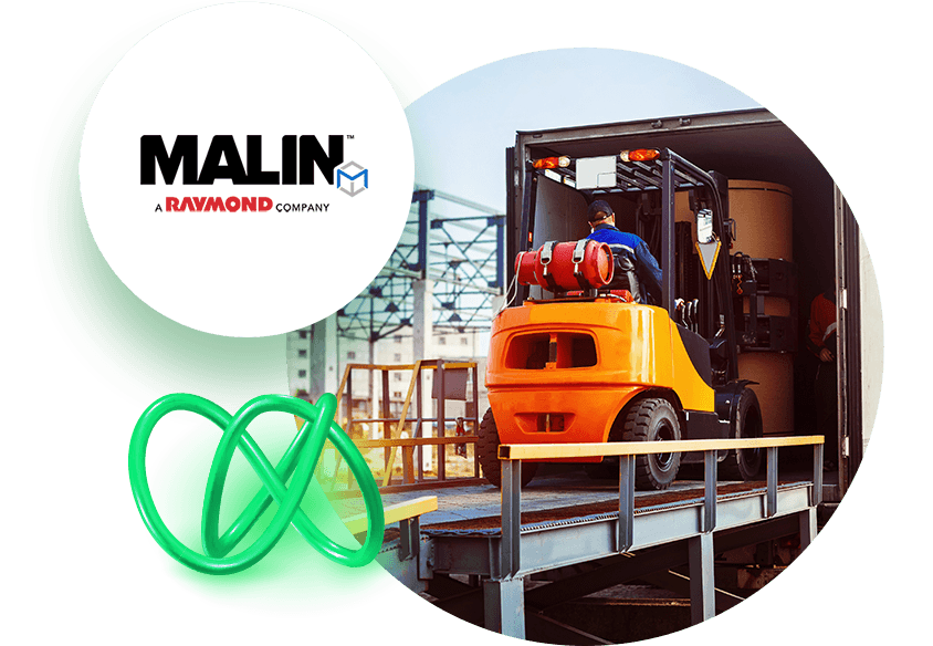 Forklift loading truck with Malin logo