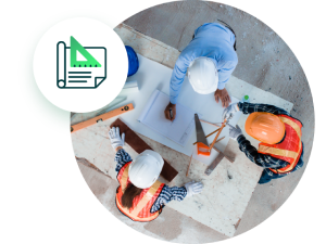 Workers standing at table looking at construction plans