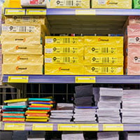 paper stacked on shelf at retail store