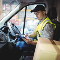 Express courier employee in truck