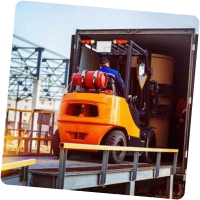 Forklift driving on ramp into back of truck