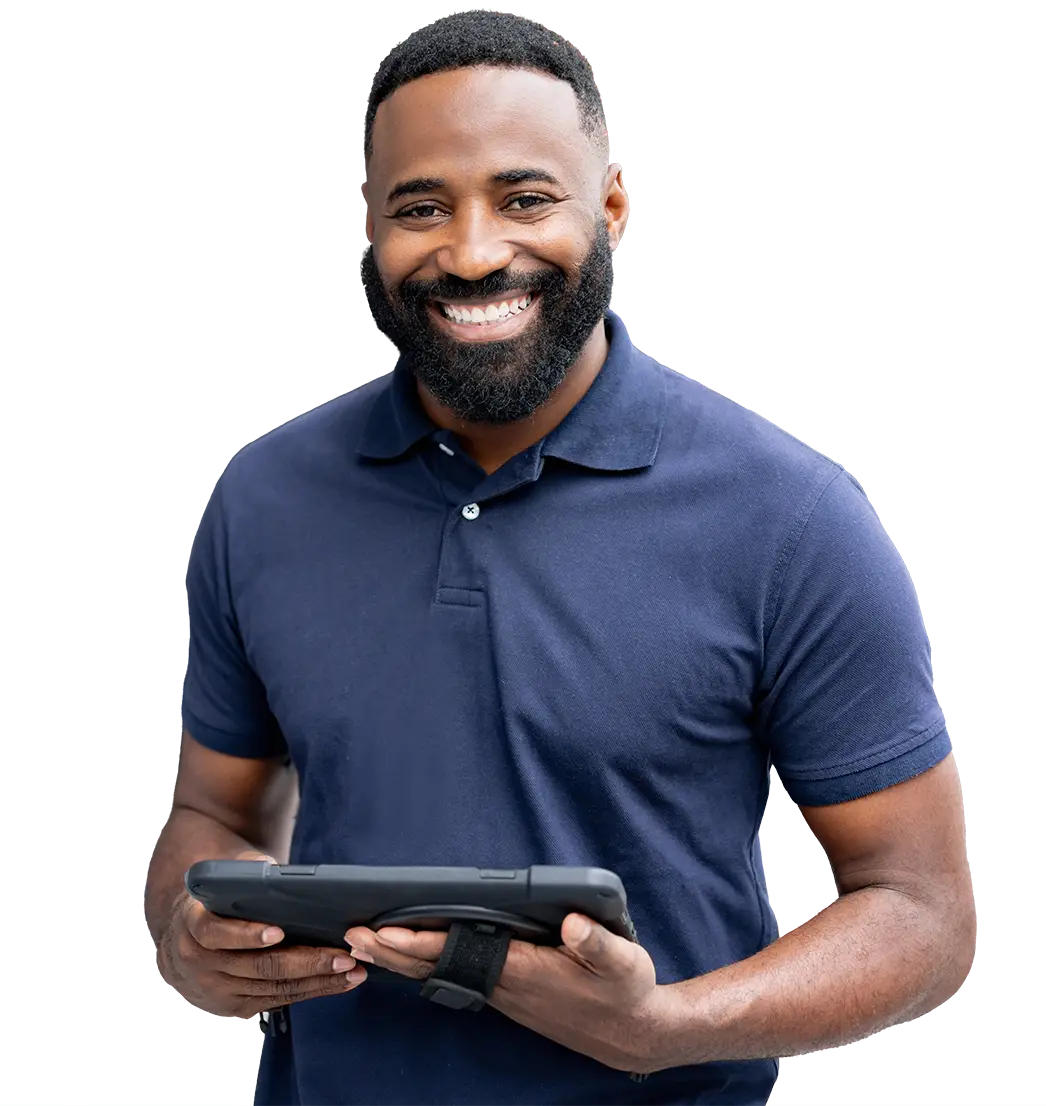 Young bearded technician wearing a polo and holding a tablet with a strap