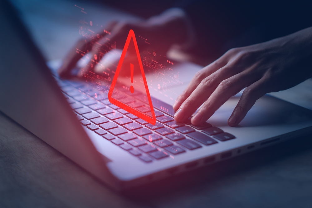 Laptop with red fraud alert