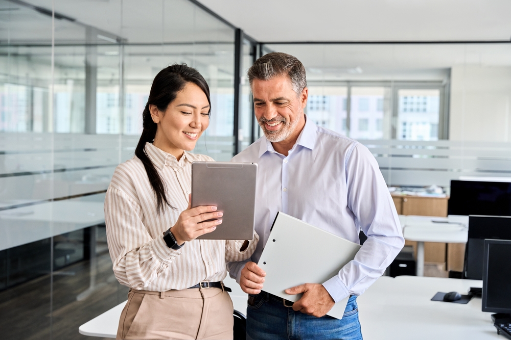Two professionals looking at tablet together
