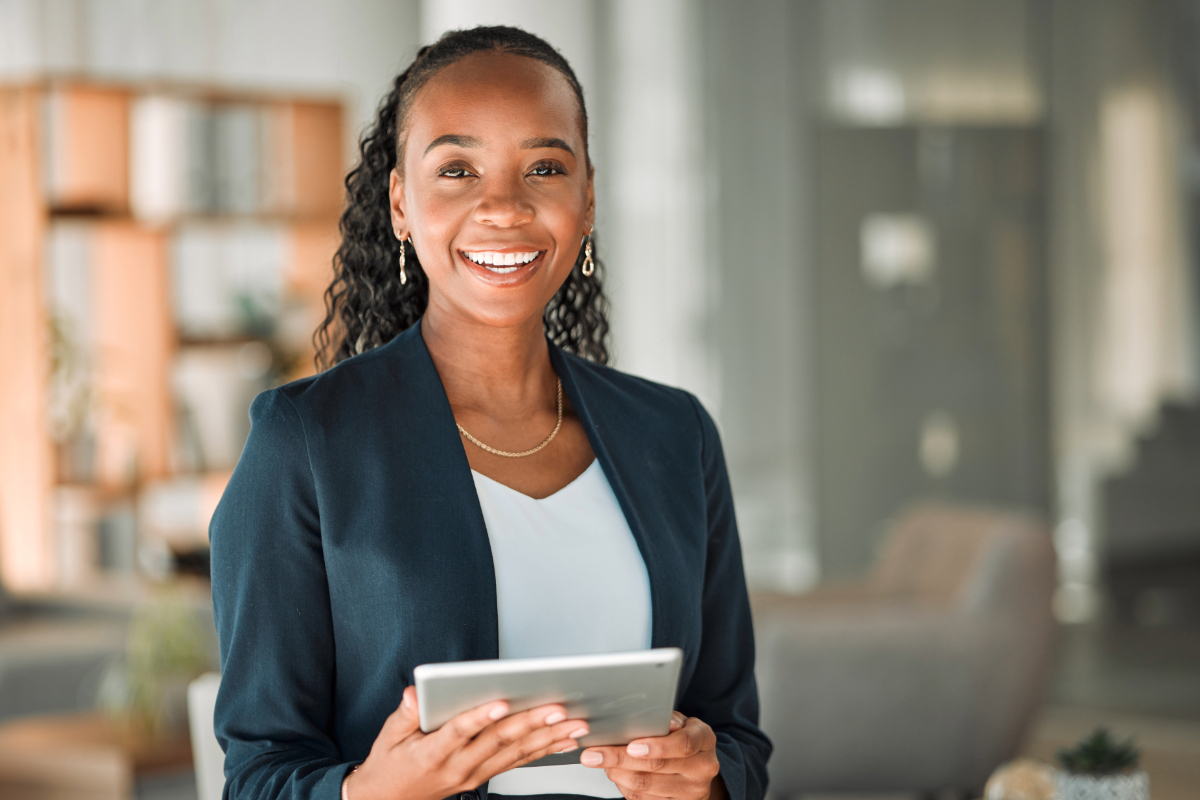 Professional holding a tablet in her office