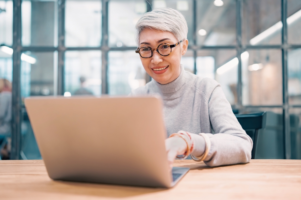Professional woman using laptop