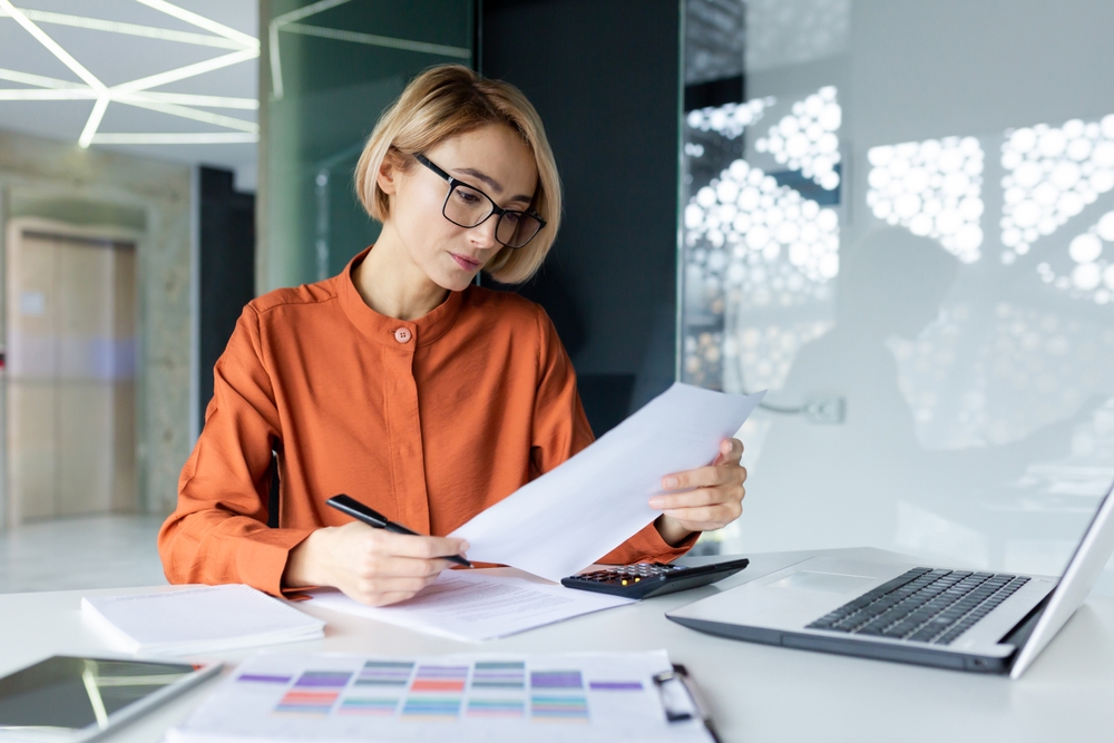 Professional looking at paperwork concernedly