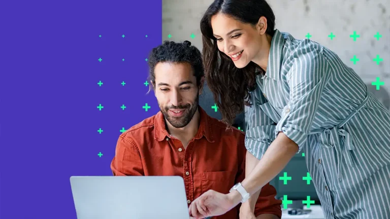 Man and woman working at computer together