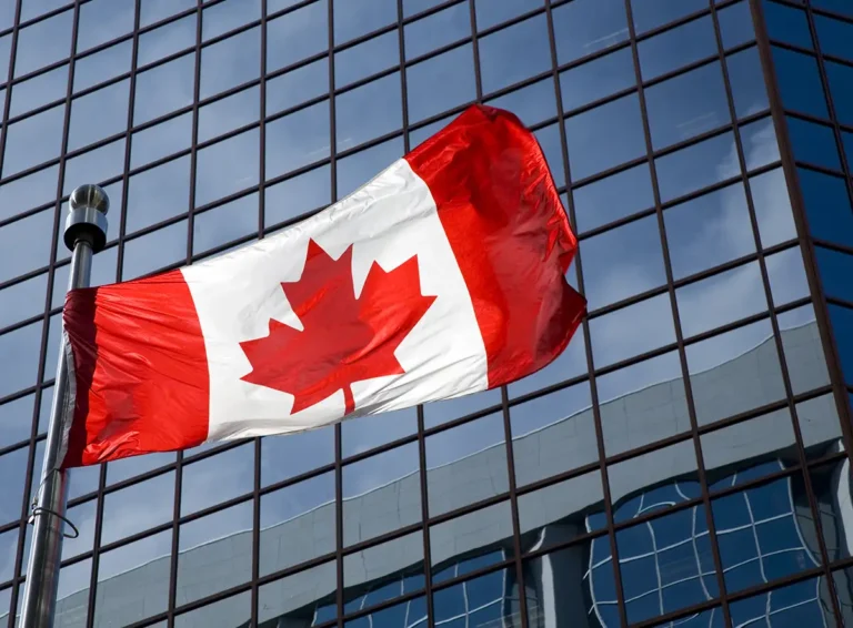canadian flag in front of office building