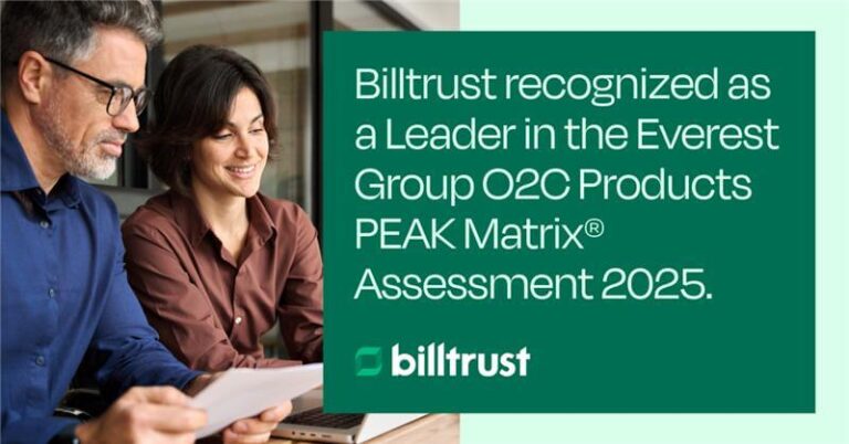 Man and woman looking at computer reading Billtrust press release