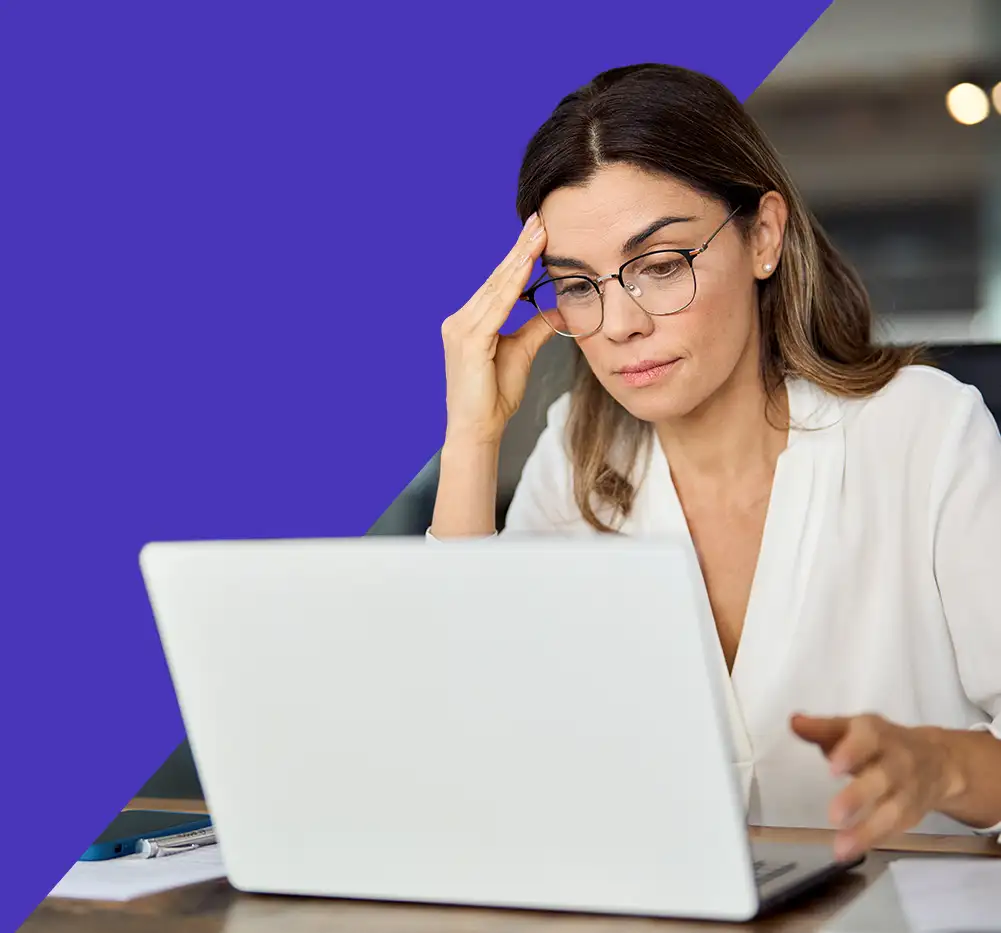 concerned woman looking at computer