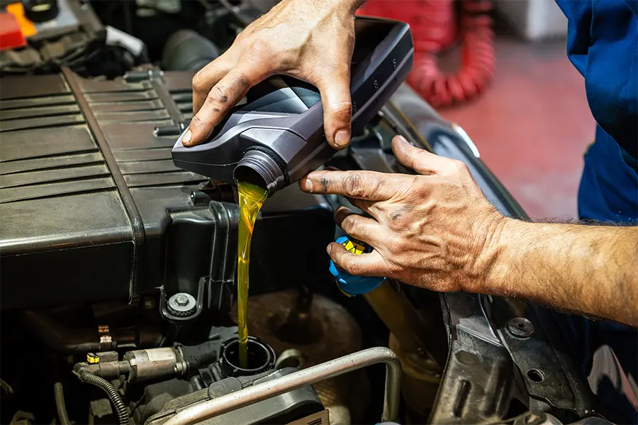pouring oil into engine