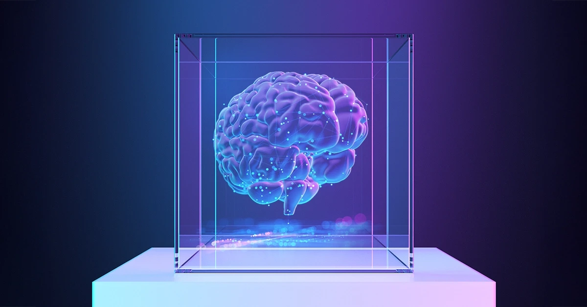 Human brain in clear cube sitting on table