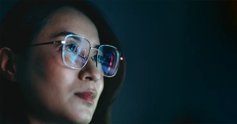woman looking to future wearing glasses