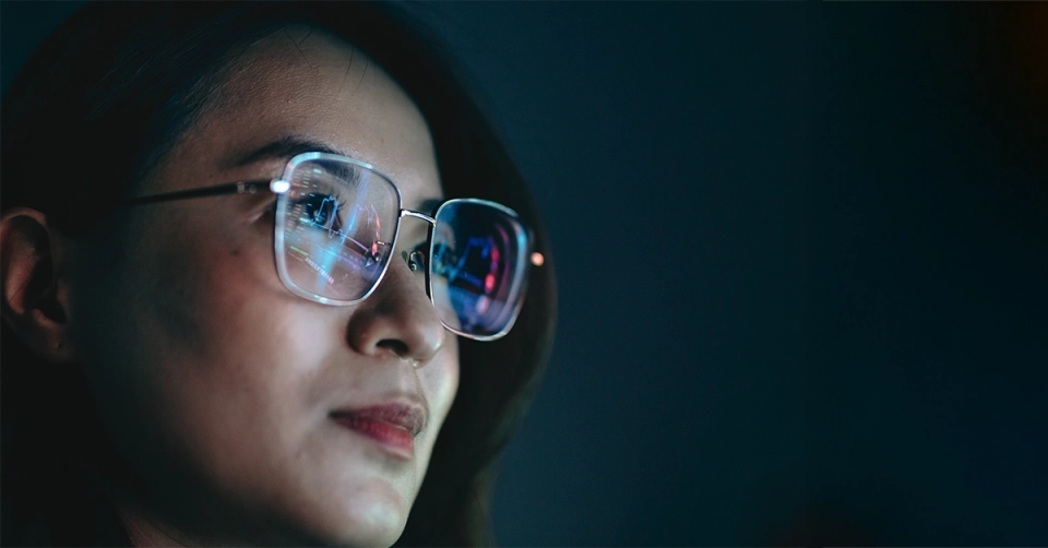 woman looking to future wearing glasses