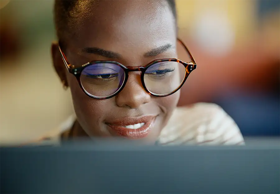 Woman smiling at computer