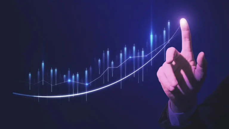 hand pointing at graph going up in a positive direction