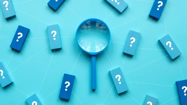 magnified glass with question marks