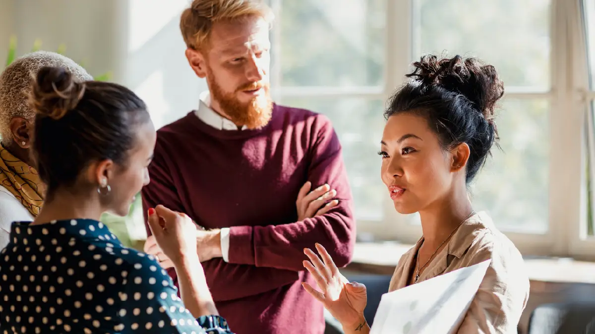 man and two women discussing credit management