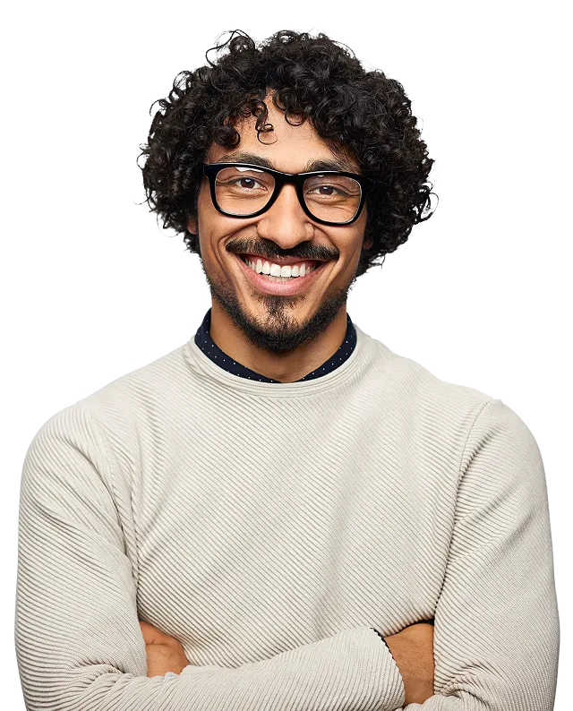 Man with curly hair and glasses smiling