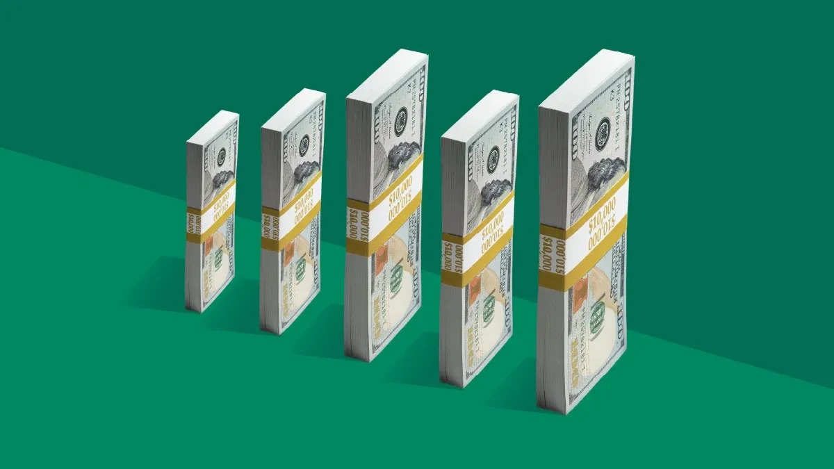 stacks of money lined up like a chart