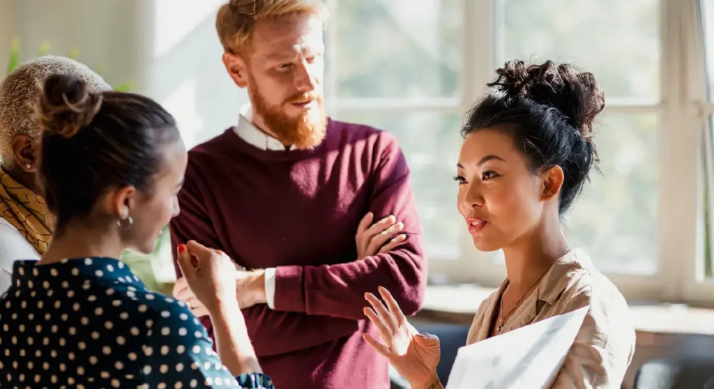man and two women discussing credit management