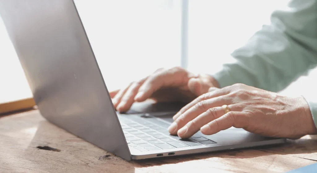 Man typing on laptop