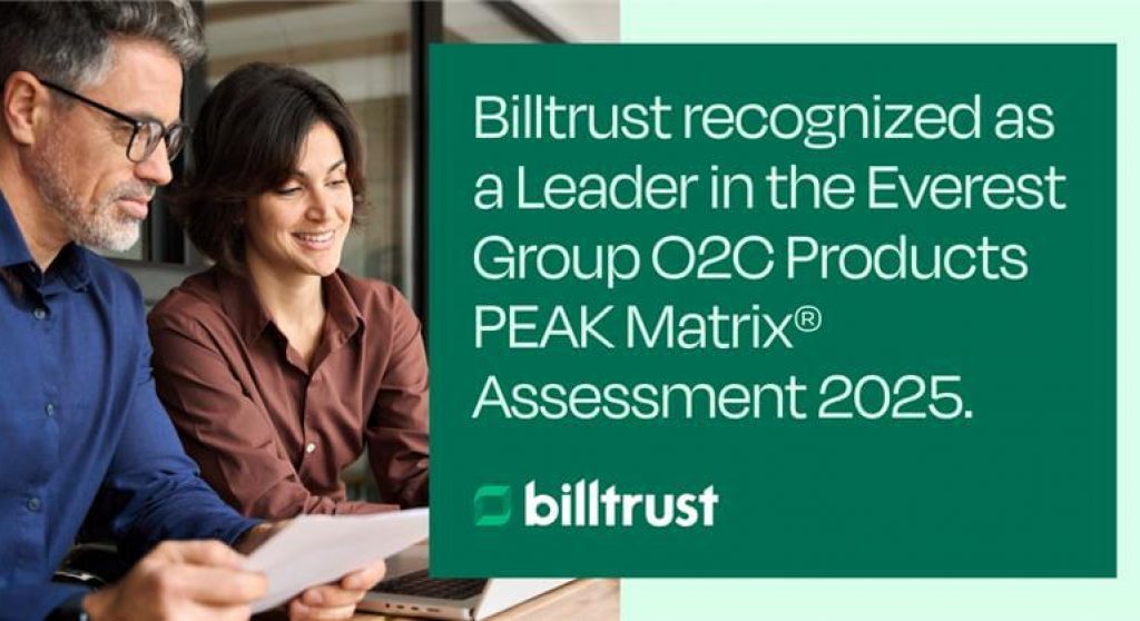 Man and woman looking at computer reading Billtrust press release