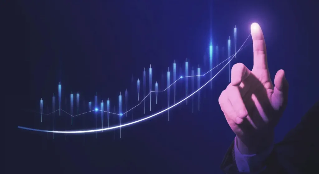 hand pointing at graph going up in a positive direction