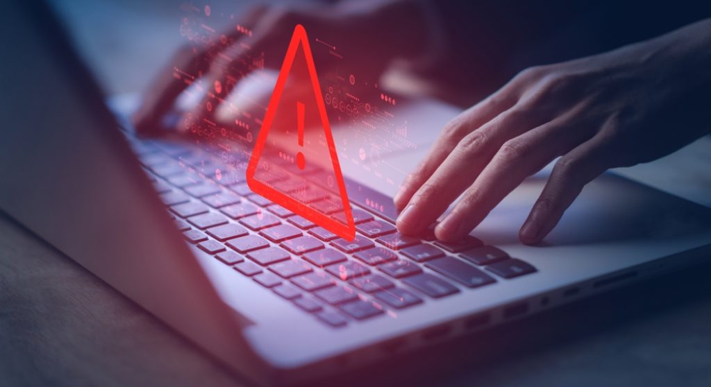 Laptop with red fraud alert