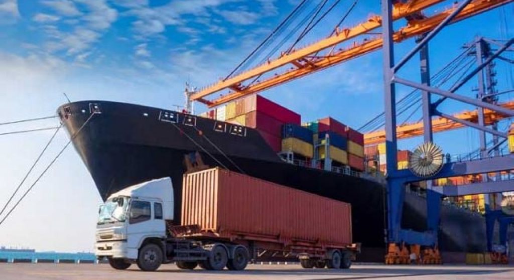 Container ship and shipping truck at a port